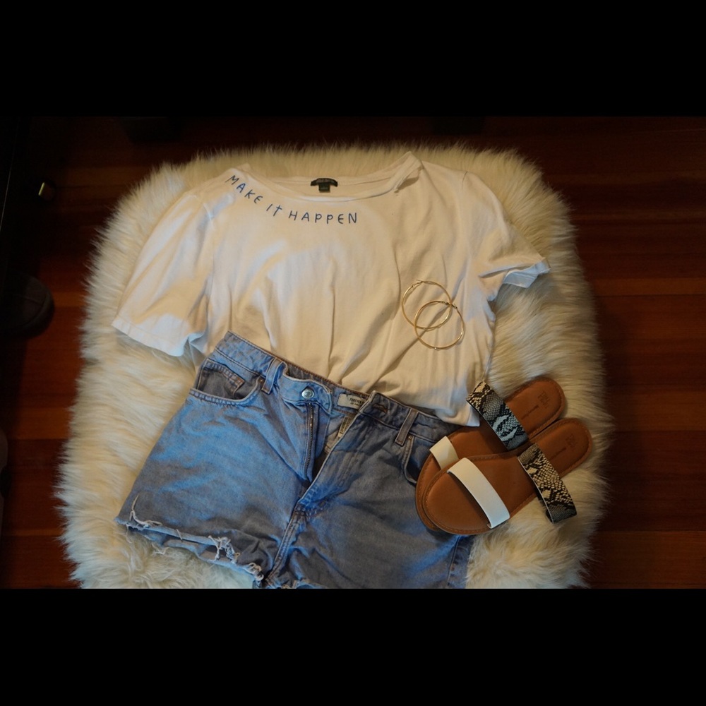 Lightwash distressed denim shorts.
